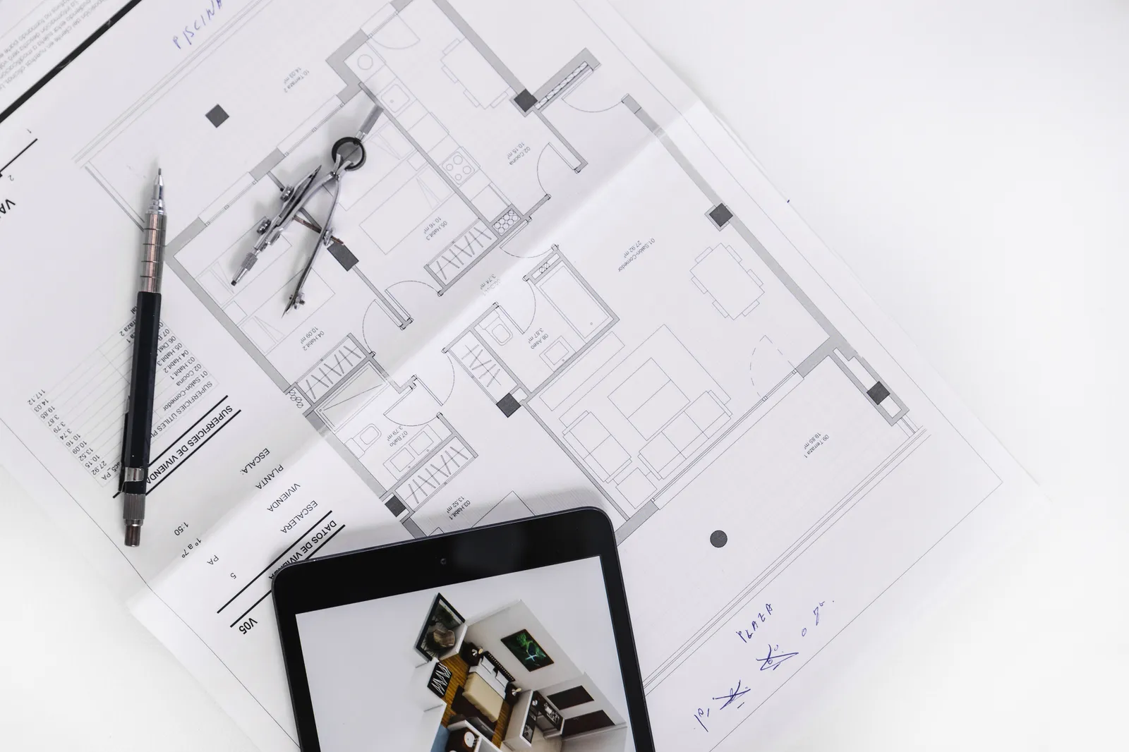Architectural floor plans and planning drawings displayed on tablet for London project review