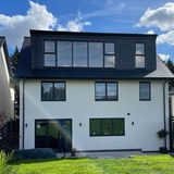 Full-width dormer loft conversion on a white rendered London house