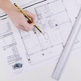 Architectural technologist marking up a London floor plan for a planning appeal
