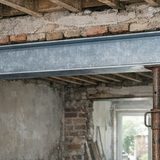 Steel beam over a new structural opening in a London house awaiting building control
