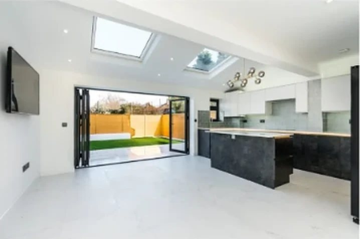 Rear extension kitchen with roof lights and bifold doors to the garden at Washington Road, London SW13